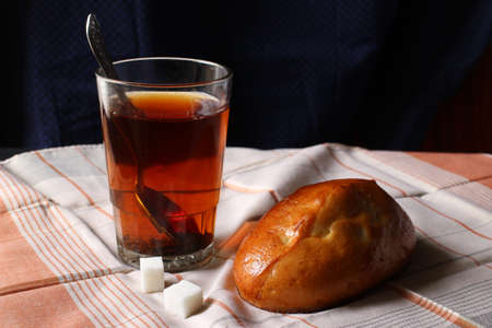Bun and tea. Simple breakfast.の写真素材