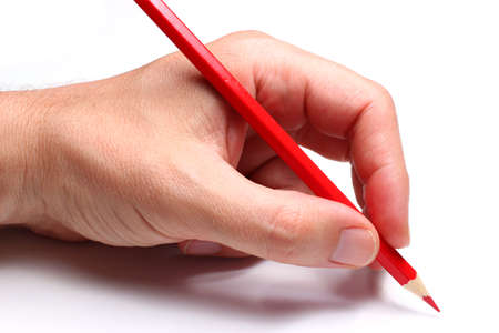 Hand writes with a red pencil. Isolate.の写真素材