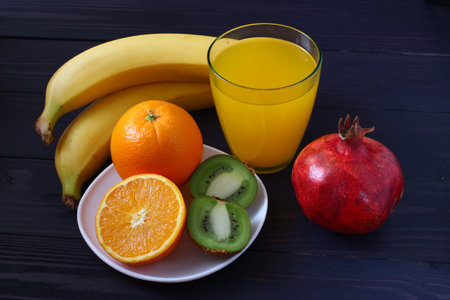 Lots of exotic fruits on a dark backgroundの写真素材