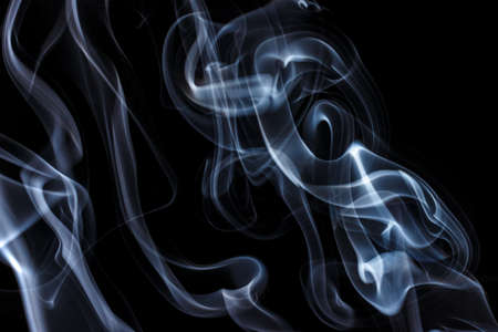 Gray thin smoke on a black backgroundの写真素材
