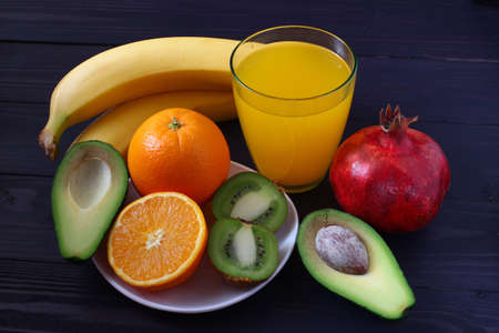 Lots of exotic fruits on a dark backgroundの写真素材