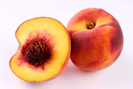 Two peaches on a white background close upの写真素材