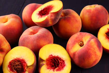 Many peaches cut whole close upの写真素材