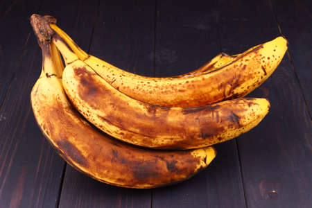 Rotten bananas on dark background close upの写真素材
