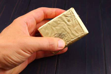 Cream of cottage cheese in the package in handの写真素材