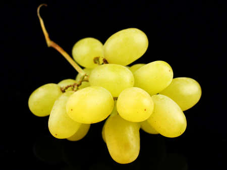 yellow grape Sultana Thompson Seedless Kishmish on black backgroundの写真素材