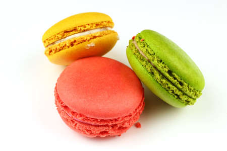 Several Macaron sweets cookies on a white backgroundの写真素材