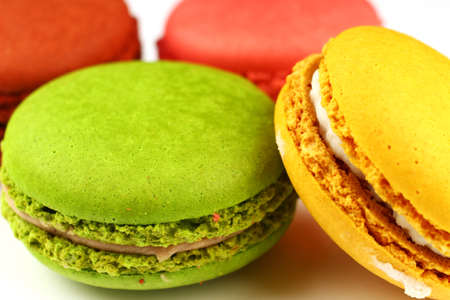 Several Macaron sweets cookies on a white backgroundの写真素材