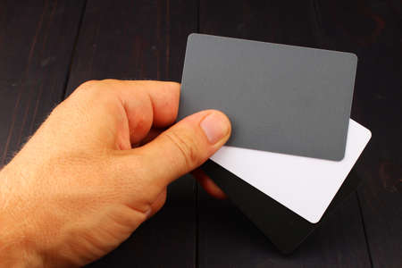 Card for white photo studio balance in handの写真素材