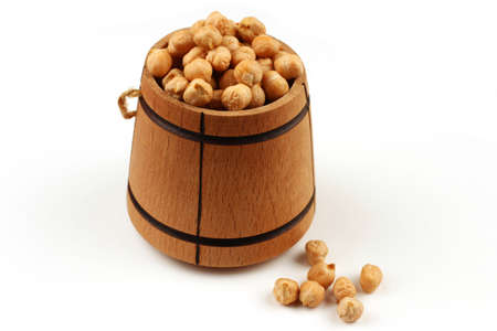 chickpeas peas in a barrel on a white backgroundの写真素材