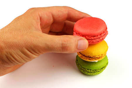 Macaroni colored pastry cookies on a white backgroundの写真素材