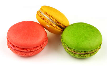 Macaroni colored pastry cookies on a white backgroundの写真素材