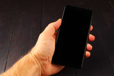 smartphone in hand close up place for text cope spaceの写真素材