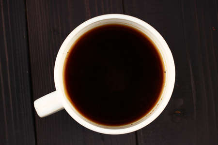 cup of coffee top view on wooden backgroundの写真素材