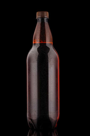 Plastic bottle of beer on a black backgroundの写真素材