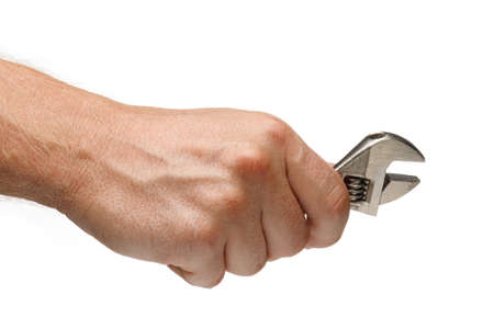 Adjustable wrench tool in hands on white isolate backgroundの写真素材
