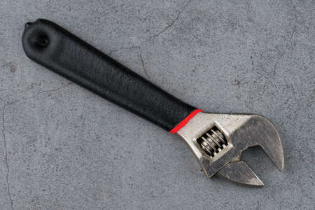 Adjustable wrench close-up. Metal hand tools.