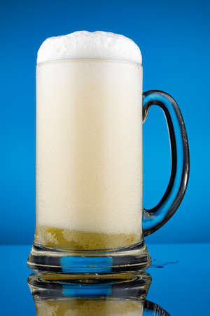 Glass glass for beer and a lot of foamの写真素材