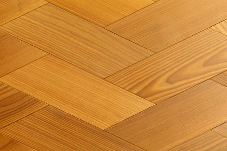Yellow parquet floor surface close-upの写真素材