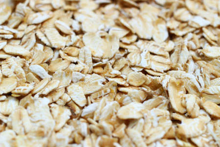 A lot of oatmeal flakes close upの写真素材