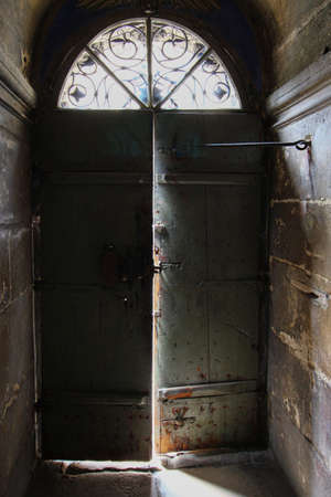 Old doors and light through the gapの写真素材