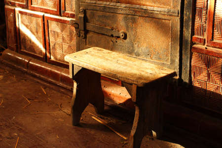 A chair in an old kitchen