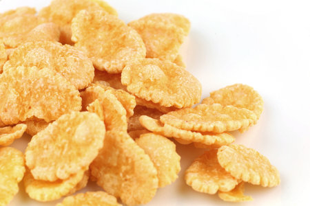 Several corn flakes on a white background