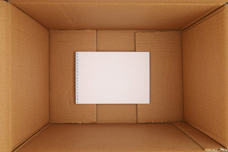 An empty notepad sheet at the bottom of the box.の写真素材