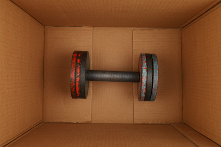 Sports dumbbell in a boxの写真素材