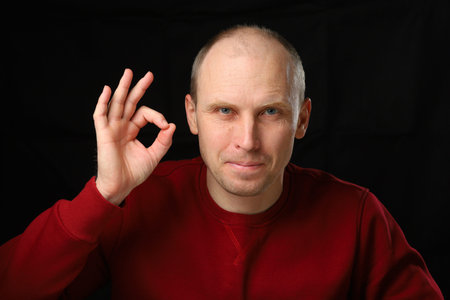 The man shows the ok gesture.の写真素材