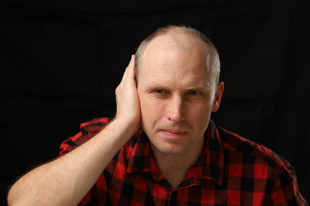 A Caucasian man grabbed his earの写真素材