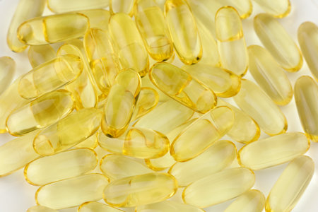 Omega 3 fish oil in yellow capsules.の写真素材