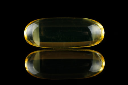 Omega 3 one yellow capsule blackの写真素材
