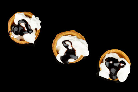 Dessert with cream and liquid chocolateの写真素材