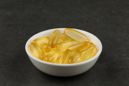 Omega 3 gelatin capsules in a white plateの写真素材