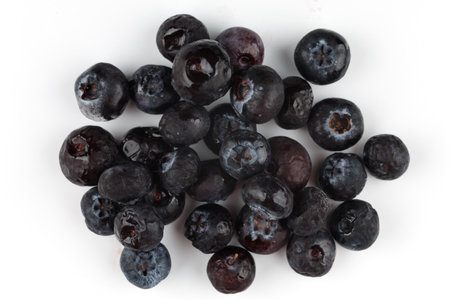 Frozen blueberries on a white background isolate. top view