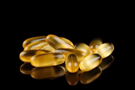 Omega 3 gelatin capsules on a black backgroundの写真素材