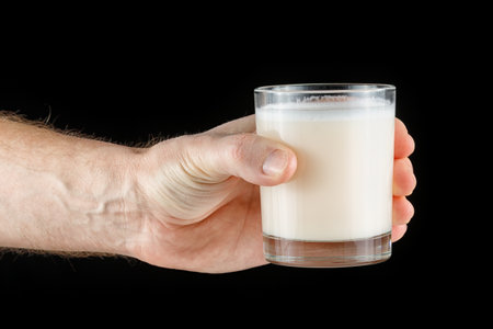 Sports nutrition in a glass in hand.の写真素材