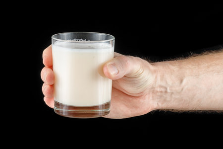 Sports nutrition in a glass in hand.の写真素材