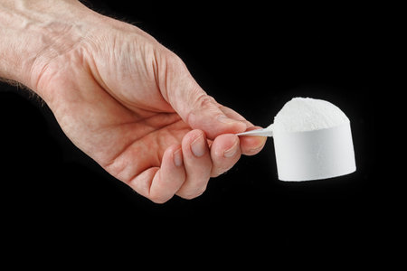 Scoop with gainer in handの写真素材