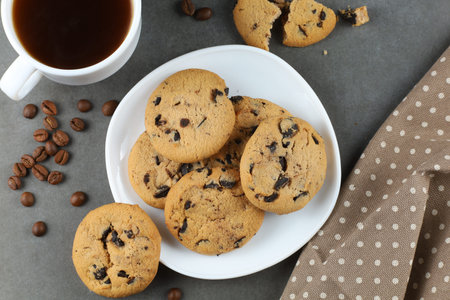 Cookies with pieces of chocolate on a plate. Sweet breakfast.の写真素材