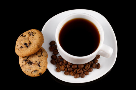 White cup of coffee and chocolate cookieの写真素材