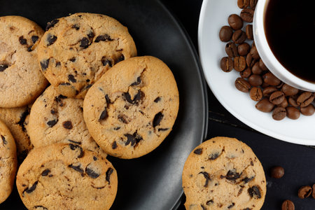 Traditional chocolate chip cookies with pieces of cocoa on a plate. Sweet breakfast.の写真素材