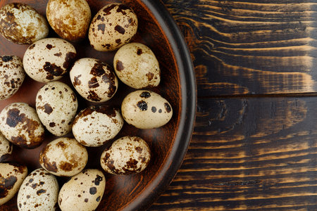 Quail eggs on a clay plate place for text cope space.の写真素材