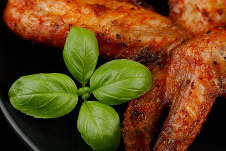 Baked chicken wings with basil.の写真素材