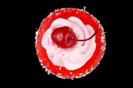Cake with cherry. Homemade cupcake iced with a cherry on topの写真素材