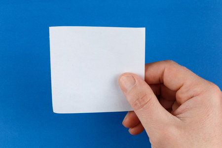 Hand holding blank sticker place for text cope spaceの写真素材
