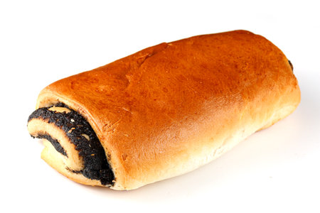 Bun with poppy seeds on white isolate. Fresh breakfast bread bagel rollの写真素材