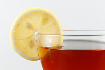 Tea with lemon in a cup. Hot tea with a lemonの写真素材