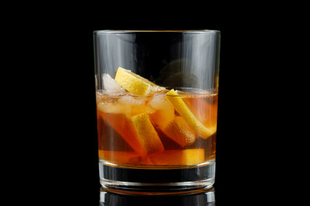 Tea with lemon in a glass. iced tea with fresh cherry and lemonsの写真素材